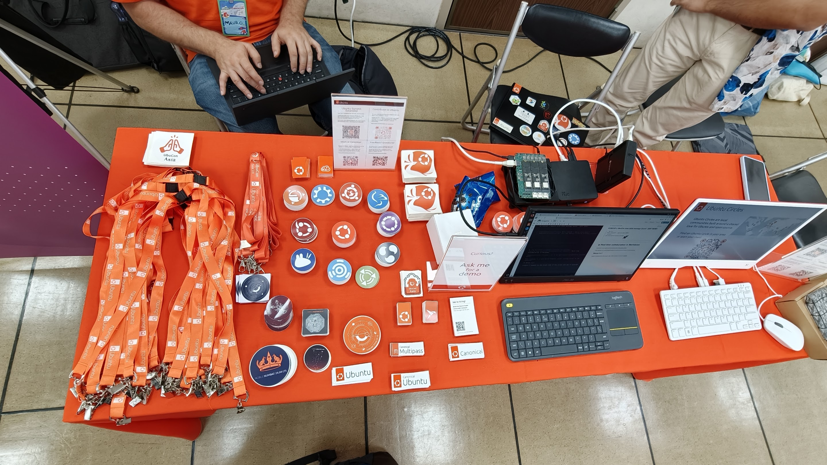 Conference swag and goodies laid out on a table